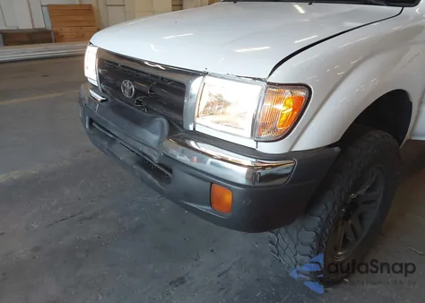1999 Toyota Tacoma from USA, damaged, VIN 4TAWM72N9XZ476149